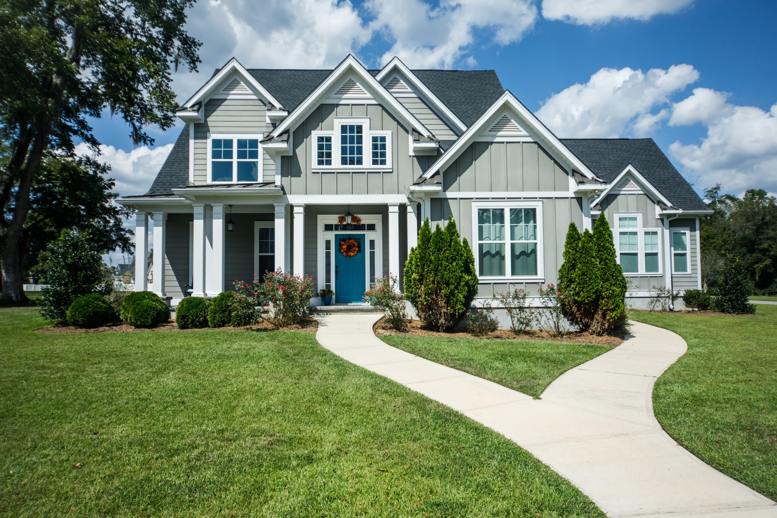 Cottage Home with Hardy Board Siding and Teal Door with Curb